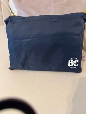 B&C Navy Travel/ beach tote- folds into a small pouch after use.
Bang & Carson